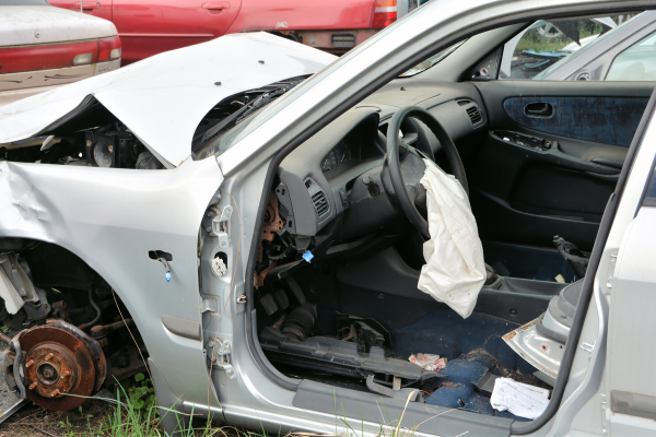 wrecked car in junkyard